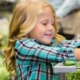 Child buying lettuce