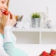 Pregnant woman eating strawberries