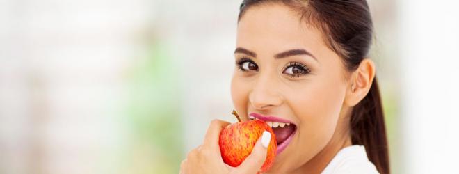 Woman eating apple