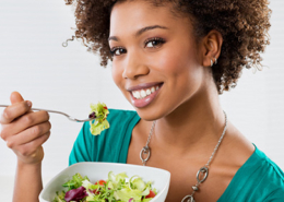 Woman eating salad