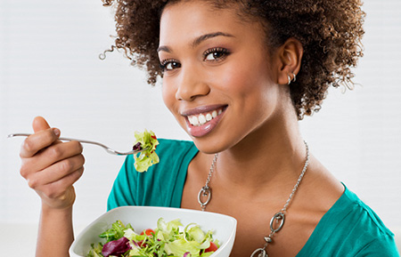 Woman eating salad